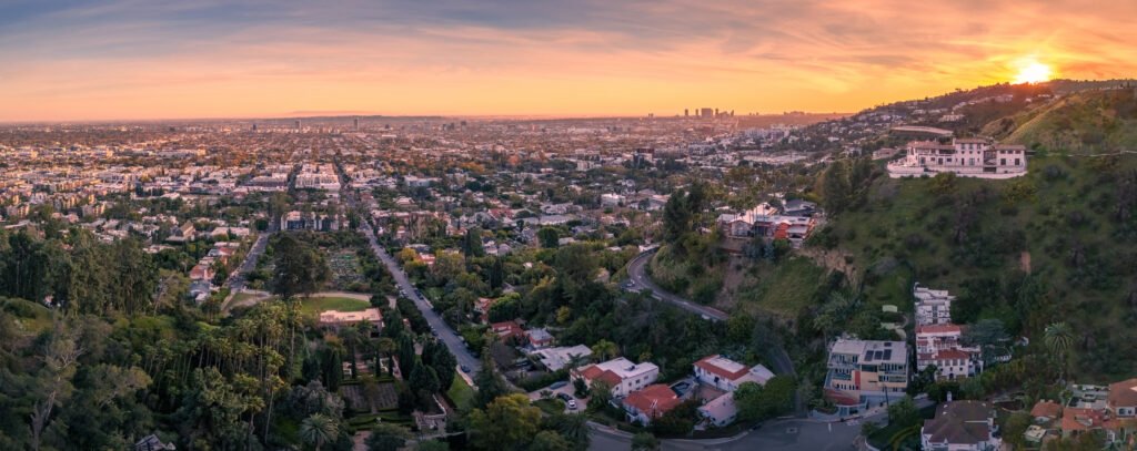 Los Angeles luxury real estate skyline view at sunset